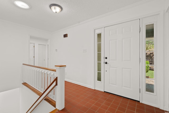 1200 Rock Creek Rd, Hot Springs, AR 71913 - entryway featuring crown molding, a textured ceiling, and dark tile patterned flooring