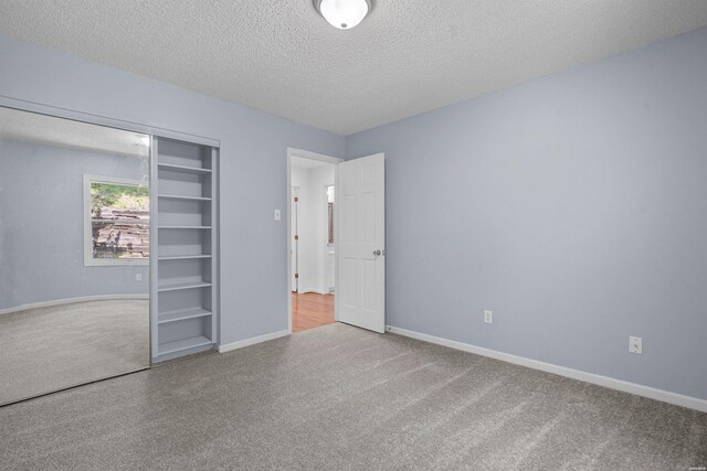 1200 Rock Creek Rd, Hot Springs, AR 71913 - unfurnished bedroom featuring carpet, a textured ceiling, a closet, and baseboards