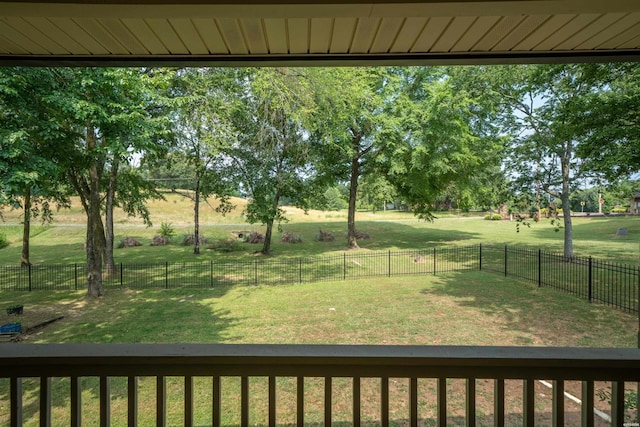 view of yard with a rural view and a fenced backyard