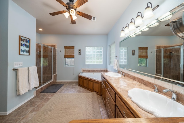 bathroom with a bath, a stall shower, visible vents, and a sink