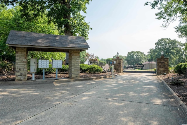 surrounding community with fence and mail area