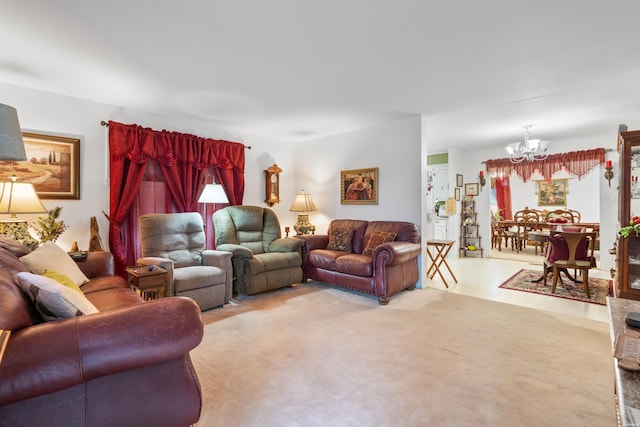 living area with an inviting chandelier and light colored carpet