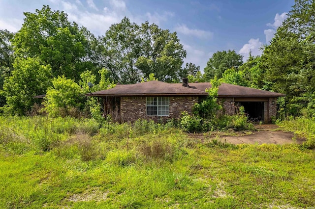2905 Bateman Rd, Okolona, AR 71962 - view of front of home with brick siding, a garage, and a chimney