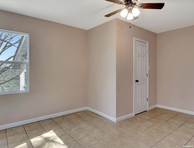 unfurnished room featuring light tile patterned floors, baseboards, and a healthy amount of sunlight