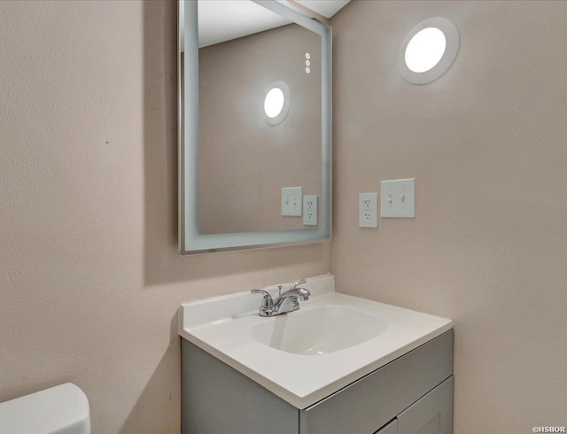 half bath with toilet and vanity