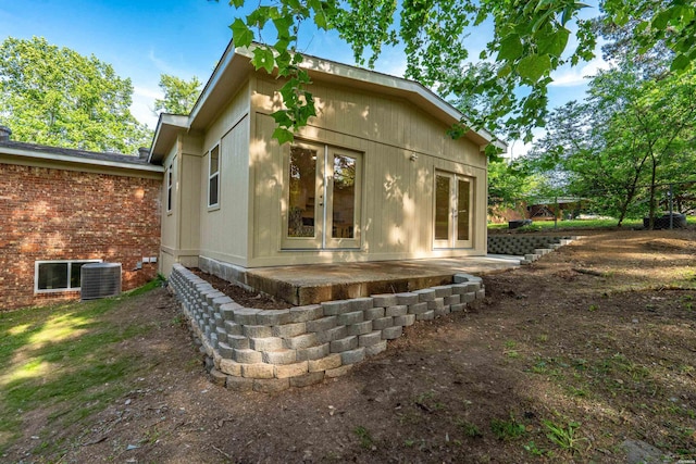 106 Grissom Trl, Hot Springs, AR 71913 - view of side of home featuring french doors, central AC unit, and a patio