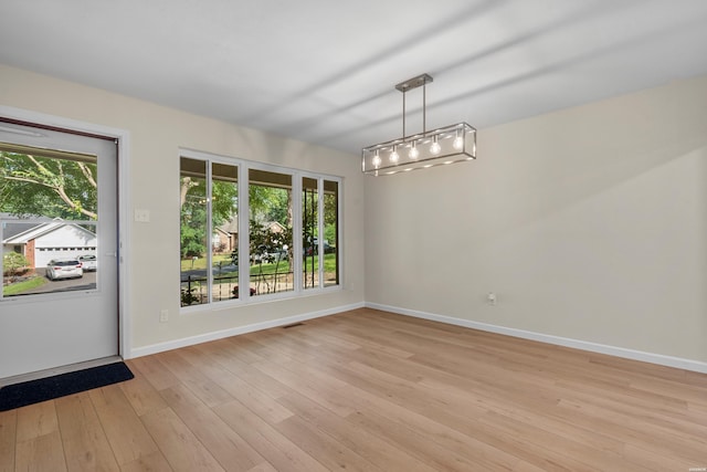 106 Grissom Trl, Hot Springs, AR 71913 - unfurnished dining area featuring baseboards and light wood-type flooring