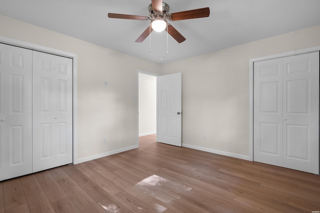 106 Grissom Trl, Hot Springs, AR 71913 - unfurnished bedroom featuring baseboards, light wood finished floors, and a ceiling fan