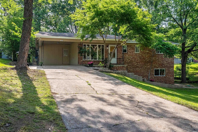 106 Grissom Trl, Hot Springs, AR 71913 - ranch-style house with driveway, brick siding, an attached carport, and a front yard
