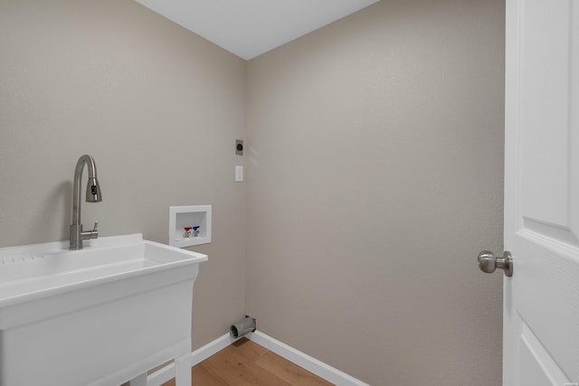 106 Grissom Trl, Hot Springs, AR 71913 - washroom with hookup for a washing machine, hookup for an electric dryer, baseboards, and light wood-style flooring