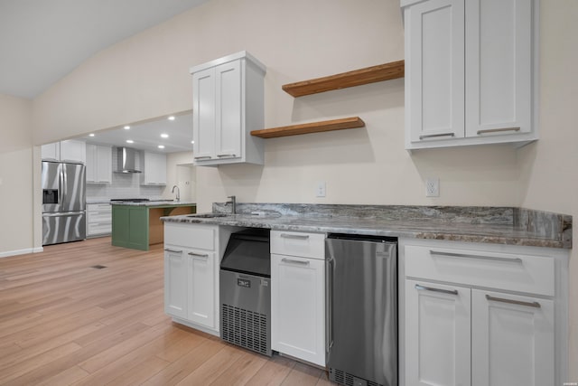 106 Grissom Trl, Hot Springs, AR 71913 - kitchen with stainless steel fridge, wall chimney exhaust hood, open shelves, white cabinets, and tasteful backsplash