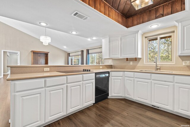 kitchen with black appliances, white cabinets, a sink, and light countertops