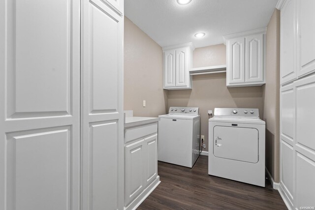 washroom featuring cabinet space, baseboards, washer and clothes dryer, dark wood-style flooring, and recessed lighting