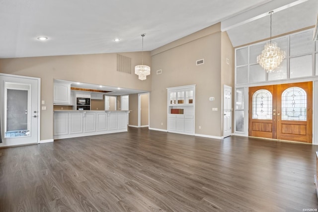 24 Excelso Ln, Hot Springs Village, AR 71909 - unfurnished living room featuring a chandelier, dark wood-type flooring, high vaulted ceiling, baseboards, and recessed lighting