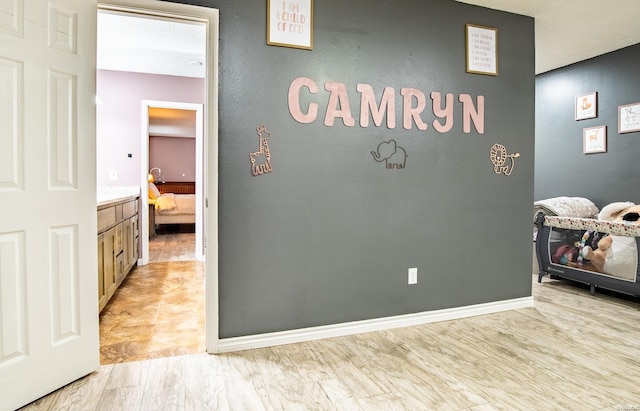 interior space with light wood-type flooring and baseboards