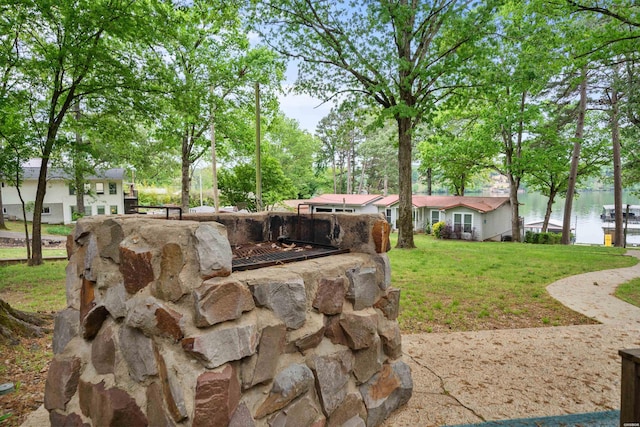 view of yard featuring fence and a water view
