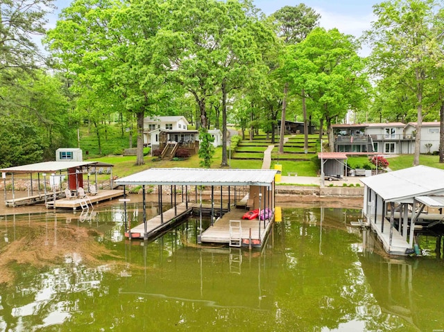 dock area with a water view and boat lift