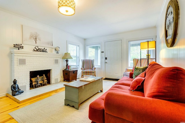 living room featuring crown molding and a healthy amount of sunlight