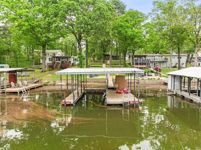 dock area with boat lift, a water view, and stairs