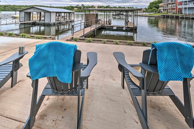 exterior space with a boat dock, a water view, and boat lift