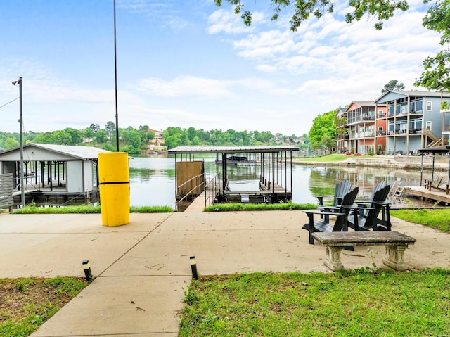 surrounding community with a water view