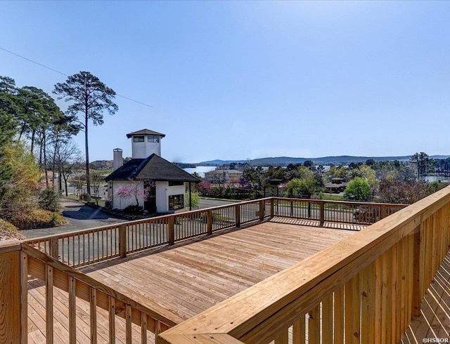 wooden deck with a mountain view