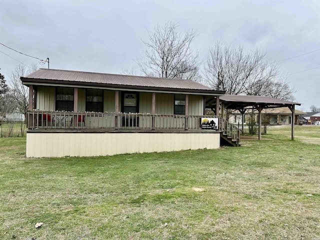 exterior space with metal roof, a porch, a lawn, and board and batten siding