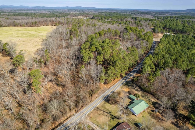 bird's eye view featuring a mountain view and a wooded view