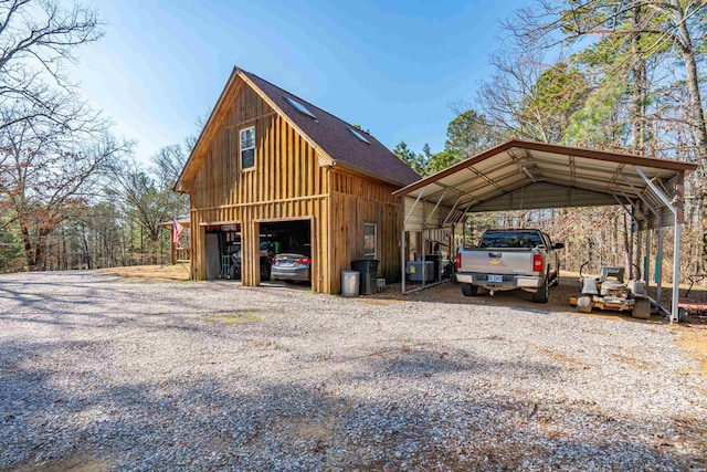 exterior space with an outbuilding and a carport