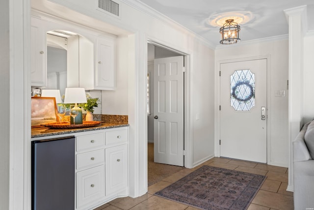 1201 Lakeshore Dr Unit 25, Hot Springs, AR 71913 - entryway with light tile patterned flooring, visible vents, crown molding, and arched walkways