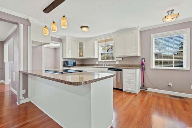 kitchen featuring dishwasher, white cabinetry, and light wood-style floors