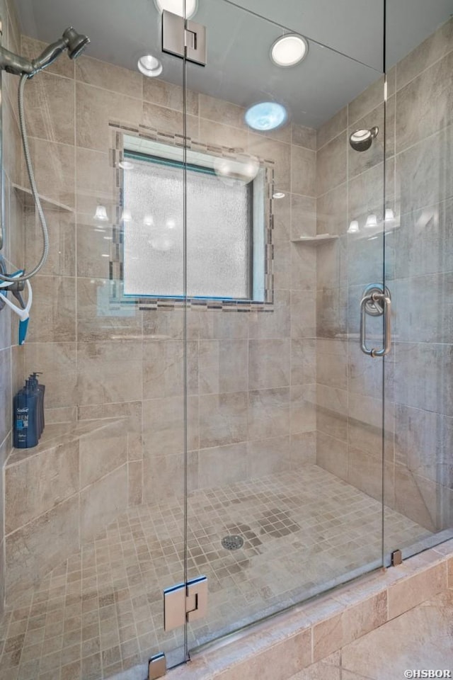 bathroom with a shower stall