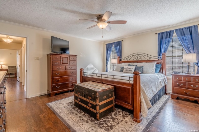 bedroom with multiple windows, wood finished floors, and crown molding