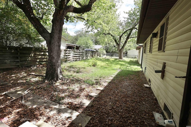 view of yard with a fenced backyard