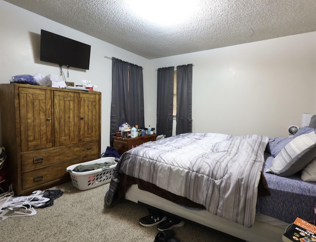 carpeted bedroom with a textured ceiling