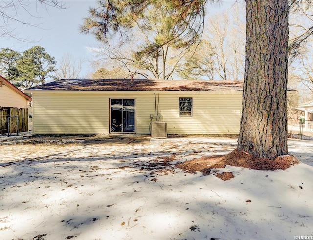 back of house with central AC