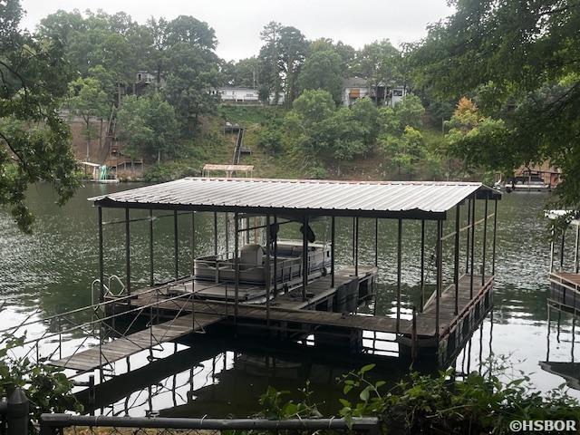 dock area featuring a water view and boat lift