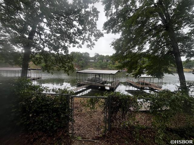 dock area featuring a water view and boat lift