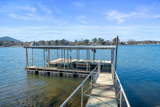 view of dock featuring a water and mountain view