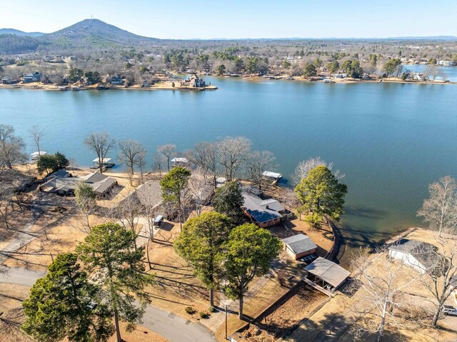 birds eye view of property featuring a water and mountain view