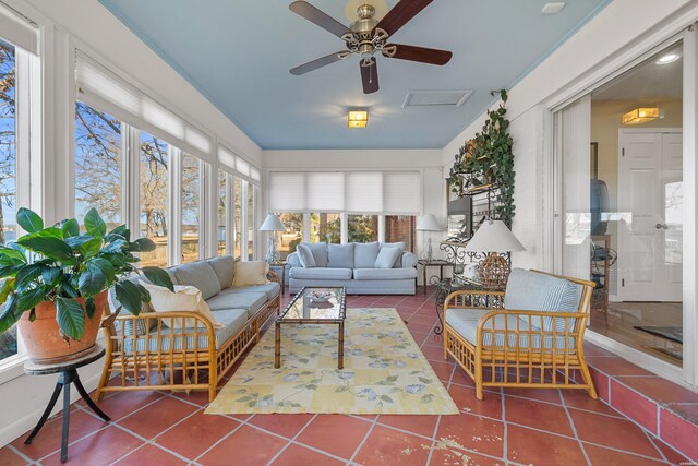 sunroom featuring ceiling fan