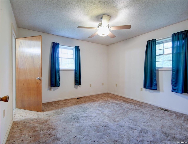 427 Morrison Rd, Arkadelphia, AR 71923 - carpeted empty room with healthy amount of natural light, a textured ceiling, and ceiling fan
