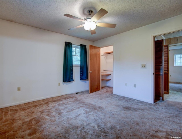 427 Morrison Rd, Arkadelphia, AR 71923 - unfurnished bedroom featuring carpet floors, a textured ceiling, and a ceiling fan