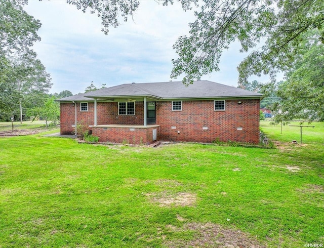 427 Morrison Rd, Arkadelphia, AR 71923 - rear view of house featuring a yard, brick siding, and crawl space