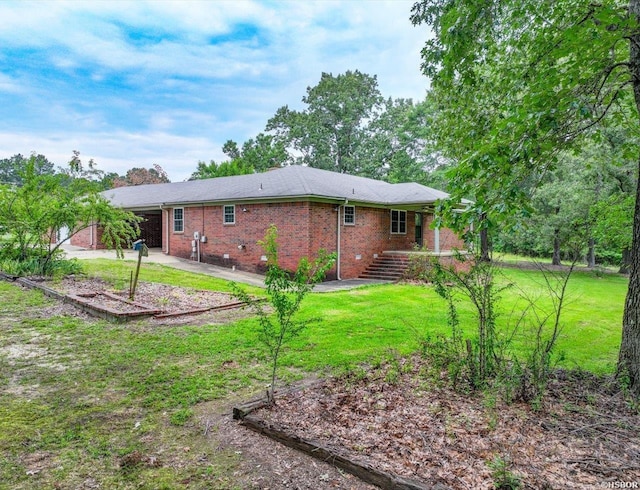 427 Morrison Rd, Arkadelphia, AR 71923 - back of property featuring brick siding and a yard