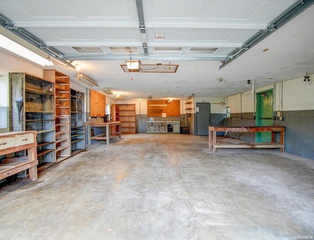 427 Morrison Rd, Arkadelphia, AR 71923 - garage with a workshop area and a garage door opener