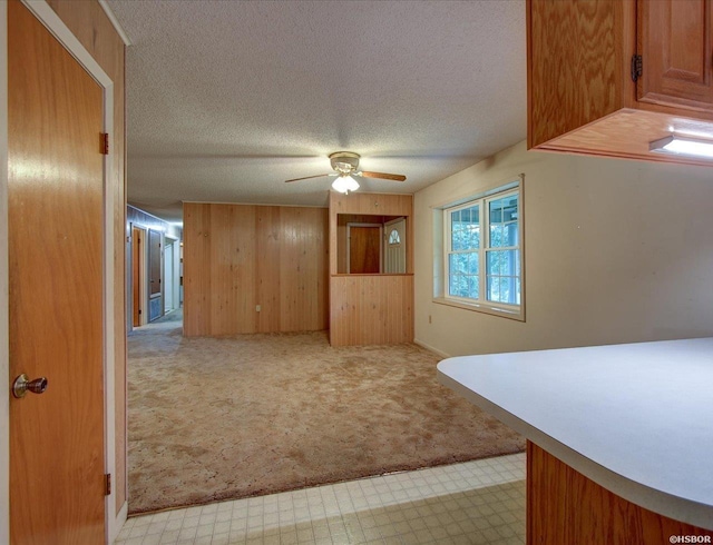 427 Morrison Rd, Arkadelphia, AR 71923 - interior space with light carpet, a ceiling fan, a textured ceiling, and wooden walls