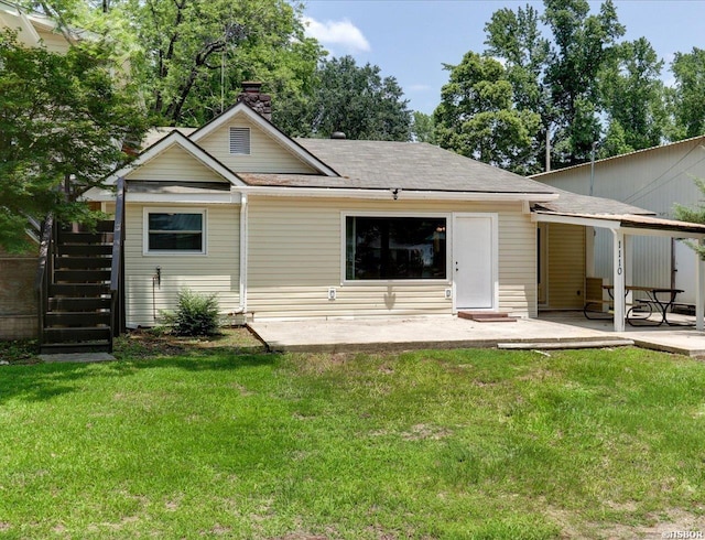 back of house with a yard, a chimney, stairway, and a patio