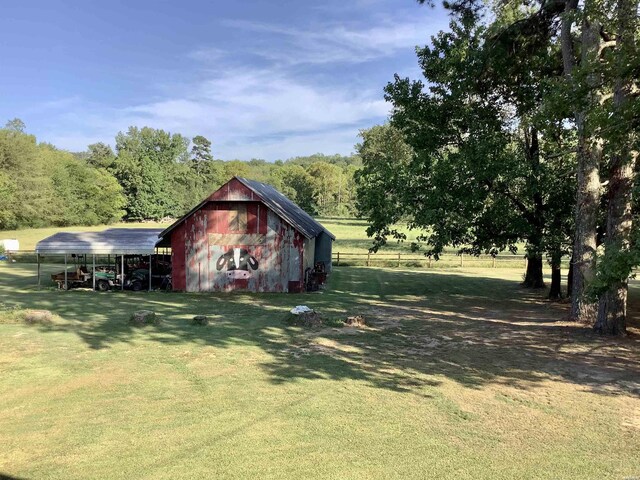 5434 Park Ave, Hot Springs, AR 71901 - view of yard featuring a carport, a barn, and an outdoor structure
