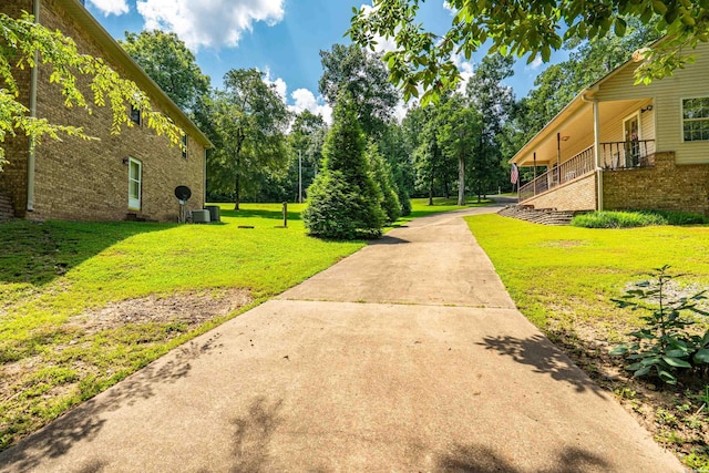 539 Charlie Stover Rd, Royal, AR 71968 - view of green lawn with concrete driveway